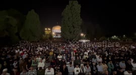 Palestinian worshipers pray during 'Night of Destiny' outside Dome of the Rock