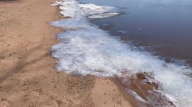 Sheets of ice wash up on Lake Superior's Wisconsin shore