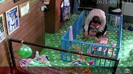 Grandpa falls to floor while carrying grandchild in Thailand