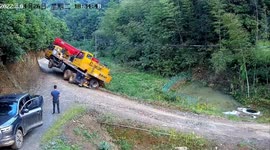 Crane topples over as road underneath collapses in China