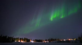 Real-time northern lights dancing over a frozen lake here in Fairbanks, Alaska!