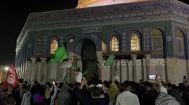 Palestinian worshipers shout slogans on the fourth Friday of the Muslim holy month of Ramadan at the Al-Aqsa Mosque in Jerusalem
