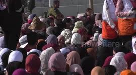 Palestinians wait to cross the Qalandia checkpoint on their way to pray at the Al-Aqsa Mosque in Jerusalem