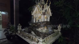 Huge python found wrapped around 'spirit house' in Thailand