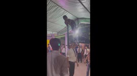 The man used his mouth to raise the iron bar with the boy lying on i
