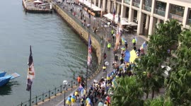 Help Ukraine Now protesters march along Circular Quay, viewed from above
