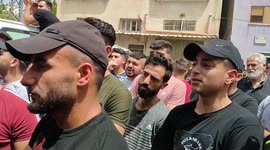 Palestinians carry the body of Yahya Edwan 27, who was killed by Israeli forces, during his funeral in the West Bank city of Qalqilya.