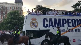 Real Madrid players celebrate La Liga win on a bus through Madrid streets