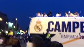 Fans celebrate their 35th La Liga title with Real Madrid players in Madrid streets