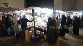 Palestinians shop ahead of Eid al-Fitr holiday, celebrating the end of the holy Muslim fasting month of Ramadan at a market, in Deir al-Balah in the center of Gaza strip.
