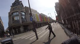 Crazy man spotted pretending to shoot at tourists and passers-by with invisible gun and rifle in the streets of Paris, rue de Rivoli, France, 1 may 2022