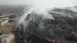 Smouldering New Delhi landfill continues to burn in India's intense heatwave