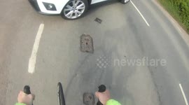 Crazy moment when cyclist gets hit by a car and flips over the car