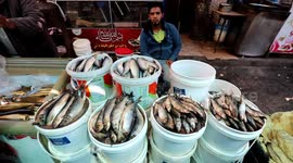 Palestinians shop ahead of Eid al-Fitr holiday, celebrating the end of the holy Muslim fasting month of Ramadan