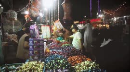 Gaza - Palestinians shop ahead of Eid al-Fitr holiday.