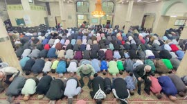 Palestinian Muslim worshipers perform the Eid al-Fitr prayer celebrating the end of the holy Muslim fasting month of Ramadan in the West Bank city of Nablus