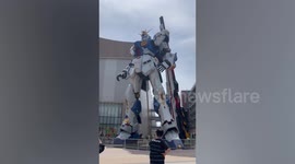 Life-size Gundam robot greets visitors at shopping mall opening day in Japan