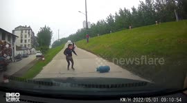 Woman sprints to stop gas cylinder rolling towards car in China