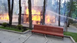 Firefighters battle blaze after Russian shells hit park in Kharkiv