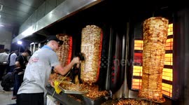 Palestinians celebrate Eid al-Fitr by digging into some shawarma
