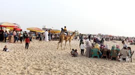 Palestinians enjoy their time on the beach as they celebrate Eid al-Fitr