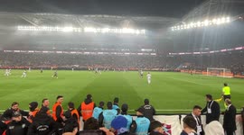 Trabzonspor fans storm the pitch after the final whistle to celebrate the championship