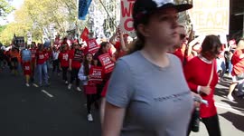 Teachers march along Macquarie Street to the NSW Parliament to protest staff shortages and working conditions