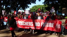 Teachers assemble in Hyde Park to march to the NSW Parliament to protest staff shortages and working conditions