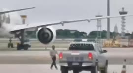 Axe-wielding man with a GUN breaks into airport runway in Thailand