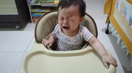 Baby stops crying instantly right after she is given a $50 buck money by her dad