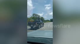 Jilted husband clings onto speeding pickup for 60 MILES after catching his wife cheating with friend