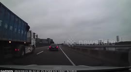 Car crashes into traffic barriers after failed overtake attempt in Taiwan