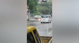 Electric cable explodes on road during rain in Thailand