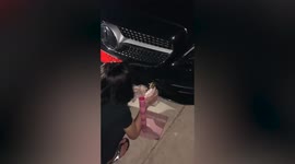 Woman rescues frog stuck in car bumper