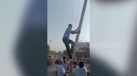 Fire brigade rescues bird stuck in electric wire in western India