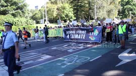 School children take part in the Election #ClimateStrike protest march from Sydney Town Hall to the Liberal Party NSW offices at 131 Macquarie Street