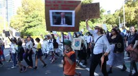 School children take part in the Election #ClimateStrike protest march from Sydney Town Hall to the Liberal Party NSW offices at 131 Macquarie Street