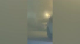 Motorists forced to park after severe Baghdad dust storm reduces road visibility