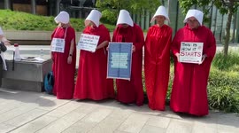 Pro-abortion protesters wear Handmaid’s Tale costumes outside the US Embassy in London