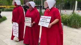 Pro-abortion protesters wear Handmaid’s Tale costumes outside the US Embassy in London