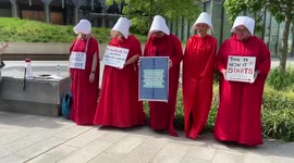 Pro-choice activists wear Handmaid’s Tale costumes outside US embassy in London