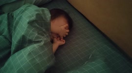 Odd sleeping position of a 10-month-old baby girl