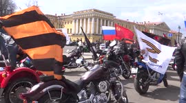 Bikers with Soviet, Russian and Z flags prepare to celebrate Victory Day in St Petersburg