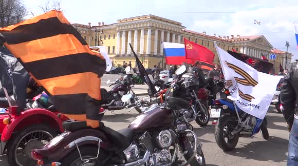 Bikers with Soviet, Russian and Z flags prepare to celebrate Victory Day in St Petersburg