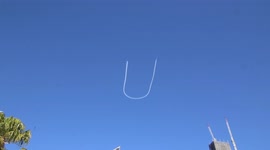 Protesters chant, “Australia stands with Ukraine!” as Ukraine is written in the sky above Song for Ukraine rally