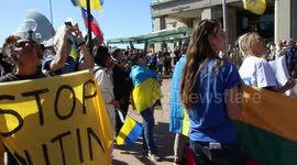 'Ukraine' is written in the sky above 'Song for Ukraine' rally
