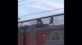 Teenagers spotted walking on moving train's roof in Moscow