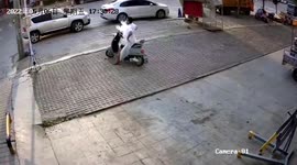 Plastic bag blown by wind wraps around scooter rider in hilarious footage