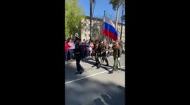 Military personnel march through Kuznetsk during Victory Day parade
