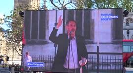 Paul Mason speaking at Russians Against The War rally with Marina Litvinenko among the crowds in Parliament Square - London